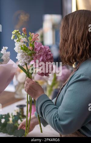 Bring the beauty of spring indoors with a stunning bouquet of freshly cut flowers from the florist Stock Photo