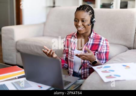 Black woman employee working from home, have online meeting Stock Photo
