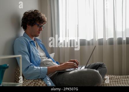 Happy businessman using laptop sending email working at home Stock Photo