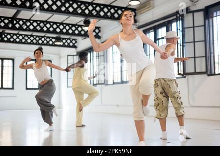 Dancers training swing movements Stock Photo