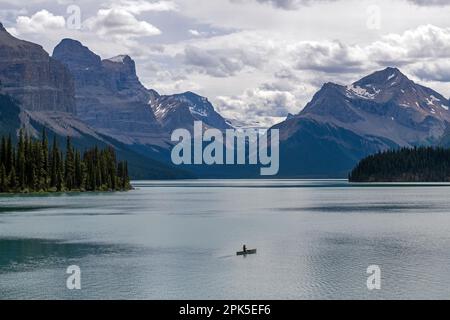 One man kayaking on Maligne Lake seen from Spirit Island, Jasper national park, Canada. Stock Photo