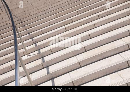 Details of a staircase made of light colored blocks, next to a wall of the same material Stock Photo