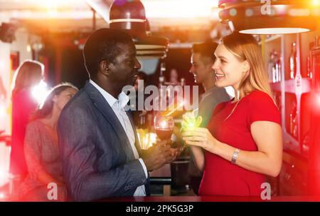 Couple are drinking cocktails and having fun in the nightclub Stock Photo