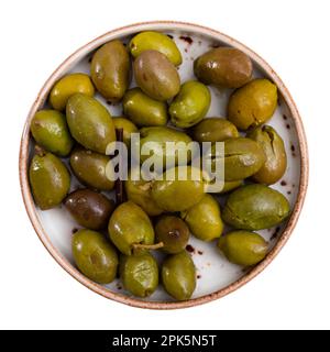 Nice serving of ripe pitted olives on plate Stock Photo