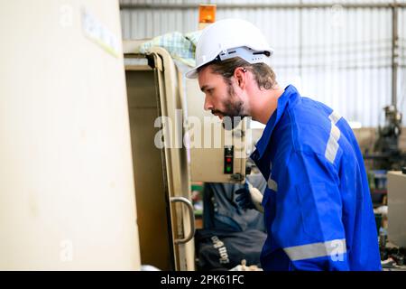 Engineer technician controlling robotic arms on computer laptop Stock Photo