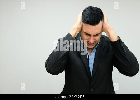 Hardworking unhappy businessman working in office company Stock Photo