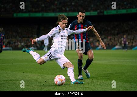 Barcelona, Spain. 5th Apr, 2023. Sergio Busquets (R) of Barcelona vies with Luka Modric of Real Madrid during the King's Cup semifinal second leg match between FC Barcelona and Real Madrid in Barcelona, Spain, April 5, 2023. Credit: Joan Gosa/Xinhua/Alamy Live News Stock Photo