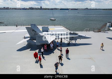 A United States Navy McDonnell Douglas F/A-18 Hornet fighter jet sits in static display on the aircraft carrier USS Yorktown in Mount Pleasant, SC, US. Stock Photo