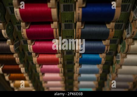 Denver, Colorado, United States - 3.4.2023: colorful thread spools in a local craft store, close up Stock Photo