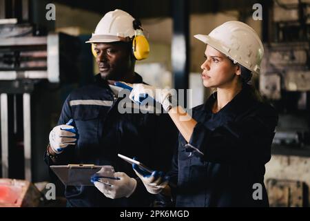 Two technicians engineers workers holding tablet checking Stock Photo