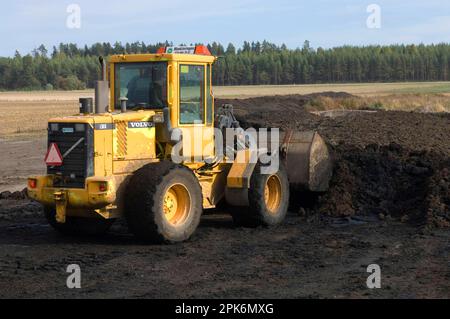 Loading Manure Volvo L50 D wheel loader, loading manure into the bucket to load the ...