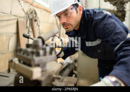 Engineer technician controlling robotic arms on computer laptop Stock Photo