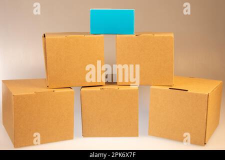 Little brown boxes in various formations on my light table Stock Photo