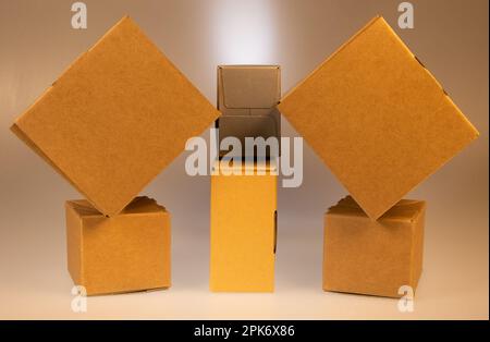 Little brown boxes in various formations on my light table Stock Photo