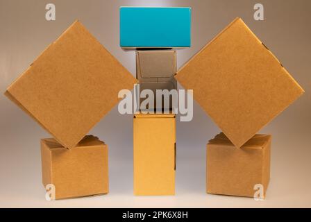 Little brown boxes in various formations on my light table Stock Photo