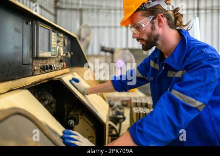 Engineer technician controlling robotic arms on computer laptop Stock Photo