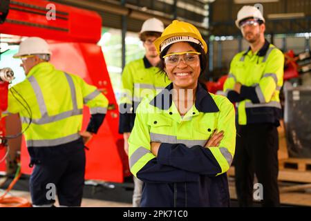 Group of technicians engineers workers posing to camera with smile Stock Photo
