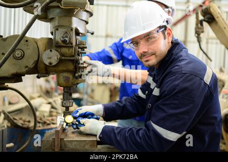 Engineer technician controlling robotic arms on computer laptop Stock Photo