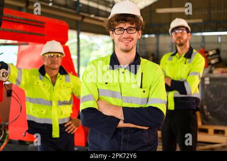 Group of technicians engineers workers posing to camera with smile Stock Photo