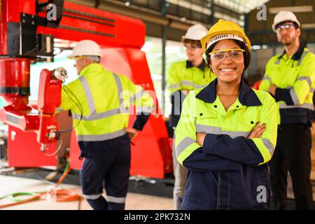 Group of technicians engineers workers posing to camera with smile Stock Photo