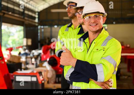 Group of technicians engineers workers posing to camera with smile Stock Photo