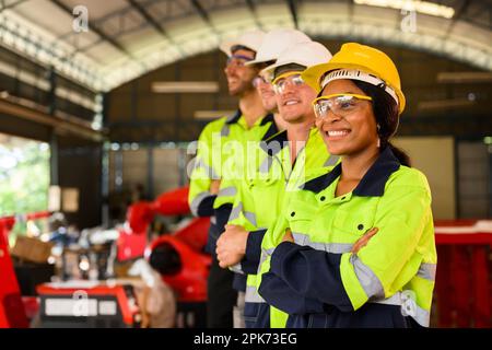 Group of technicians engineers workers posing to camera with smile Stock Photo