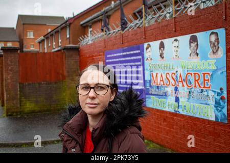 Natasha Butler granddaughter of Paddy Butler who was killed during the Springhill Westrock killings in front of the mural commemorating . Stock Photo