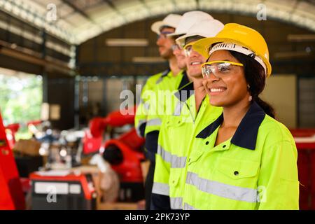 Group of technicians engineers workers posing to camera with smile Stock Photo