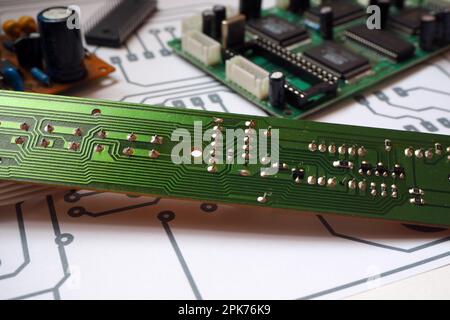 Printed circuit board on electronic schematic Stock Photo