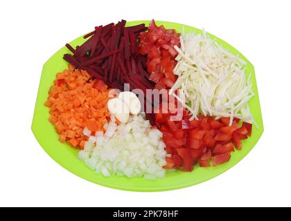 Raw vegetables are cut to cook Ukrainian borscht. Isolated on white Stock Photo