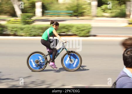 MERIDA, MEXICO - OCTOBER 23, 2016 Sunday cycling on the  Paseo de Montejo - girl with black leggings Stock Photo