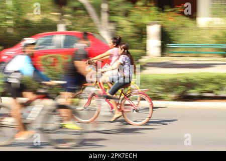 MERIDA, MEXICO - OCTOBER 23, 2016 Sunday cycling on the  Paseo de Montejo - two young girls Stock Photo