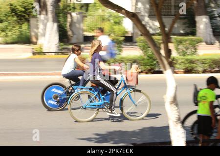 MERIDA, MEXICO - OCTOBER 23, 2016 Sunday cycling on the  Paseo de Montejo - two young girls Stock Photo