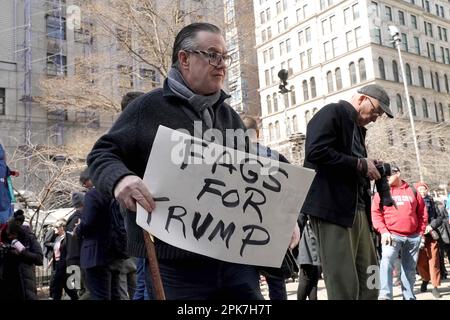 New York, United States. 03rd Apr, 2023. A Pro-Trump supporter holds a placard reading 'Fags for Trump' during a demonstration in support of Donald Trump prior to Trump's indictment, outside the New York criminal court building. Credit: SOPA Images Limited/Alamy Live News Stock Photo