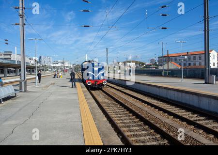 PORTO, PORTUGAL - NOVEMBER 1, 2022 Campanha Train Station with a blue engine just pulling in Stock Photo