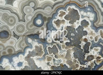 Agate, beautiful decorative stone, abstract blue, gray and white pattern, natural background Stock Photo