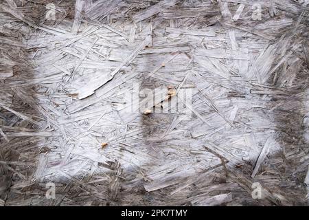 Old white paint on particle board, chipboard, close up. Stock Photo