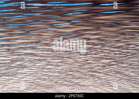 River water surface details, reflections and abstracts, ripples and patterns. Stock Photo