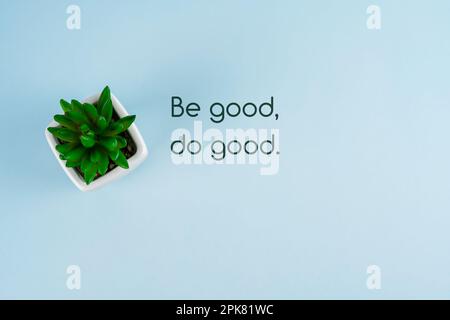 Be good, do good quotes on blue background with potted plant Stock Photo