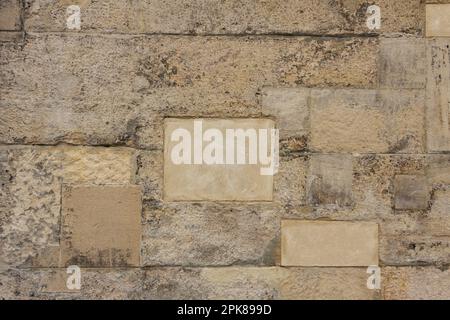 The texture of the stone wall of the ancient city. Nice light beige tones. Great background for web design Stock Photo