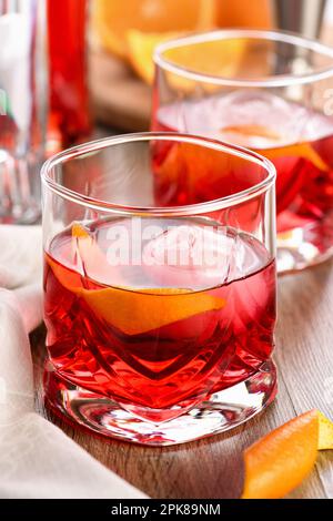 A classic Negroni made with equal parts Campari, gin and sweet vermouth and garnished with orange zest. The perfect aperitif before dinner Stock Photo