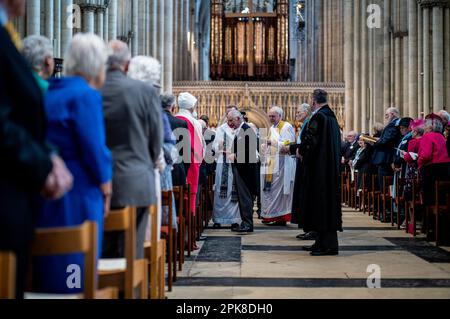 King Charles III distributes the Maundy Money during the Royal Maundy Service at York Minster. Picture date: Thursday April 6, 2023. Stock Photo