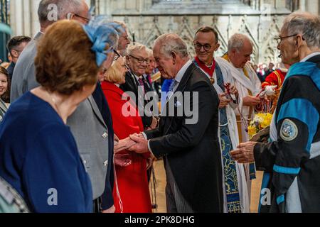 King Charles III distributes the Maundy Money during the Royal Maundy Service at York Minster. Picture date: Thursday April 6, 2023. Stock Photo