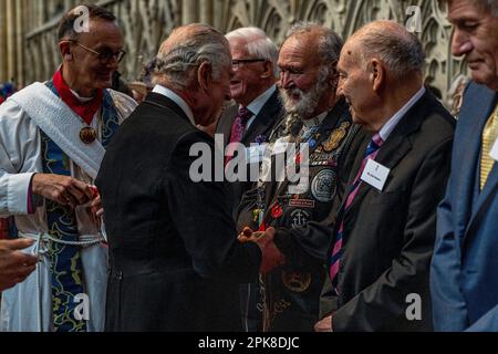 King Charles III distributes the Maundy Money during the Royal Maundy Service at York Minster. Picture date: Thursday April 6, 2023. Stock Photo