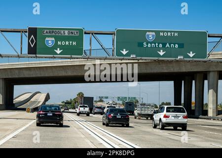 driving in the carpool lane on Interstate 5 north towards Santa Ana, Los Angeles in light traffic early afternoon Stock Photo