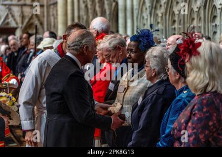 King Charles III distributes the Maundy Money during the Royal Maundy Service at York Minster. Picture date: Thursday April 6, 2023. Stock Photo