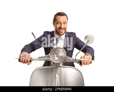 Businessman riding a silver scooter and smiling isolated on white background Stock Photo