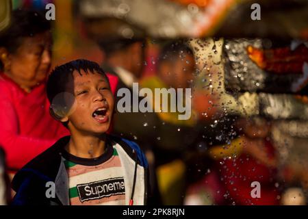 Kathmandu, Nepal. 6th Apr, 2023. A boy takes a holy bath during the Baishak Asnan festival in Kathmandu, Nepal, April 6, 2023. The locals believe that taking a holy bath on this day purifies one's spirit and makes one free from skin diseases. Credit: Sulav Shrestha/Xinhua/Alamy Live News Stock Photo