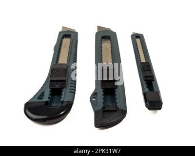 Set of box cutter on a white background. Stationery knife set. Stock Photo
