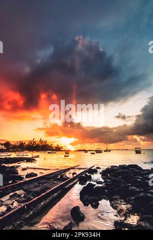 Cape Malheureux in the north of Mauritius, beautiful bay with beach and harbor, sandy beach in the evening for sunset Stock Photo